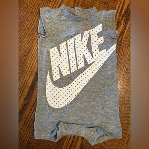 Nike Gray Romper with White Logo. 6 months. Snaps at back neck & crotch. Girl.